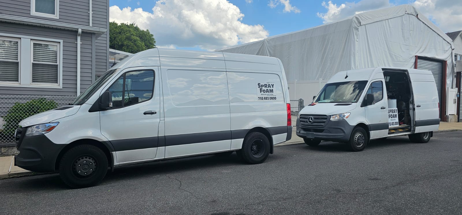 Puza Construction vans parked on a street