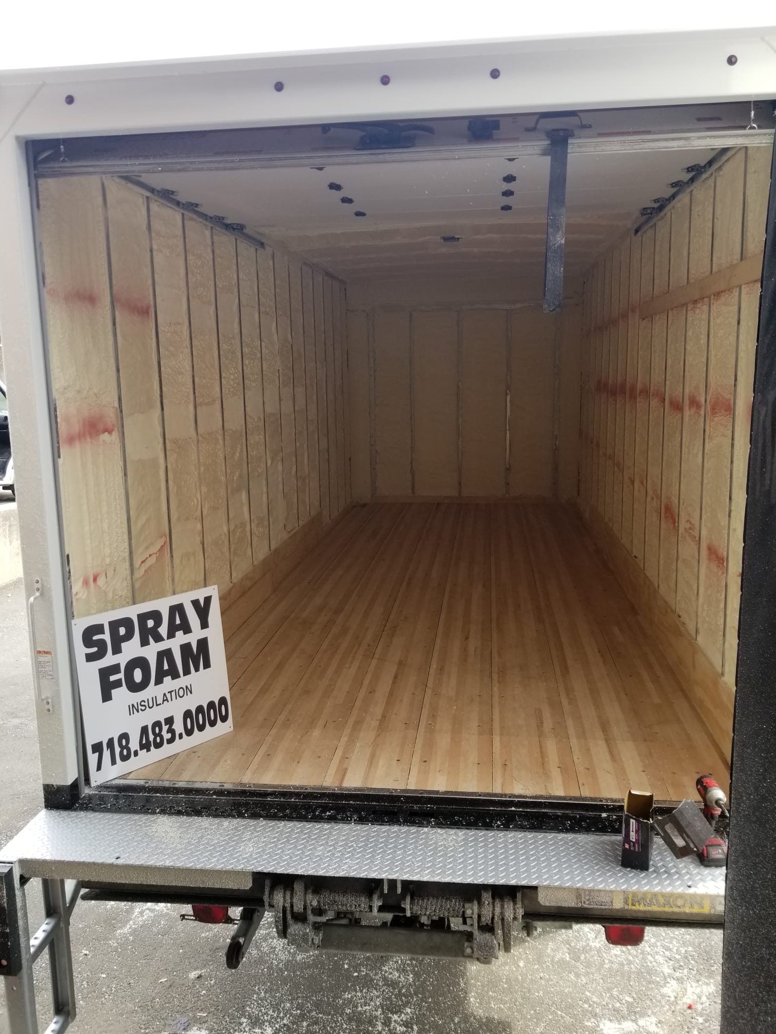 Cargo box of a truck insulated with spray foam